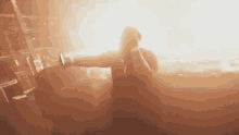 a blurry picture of a man holding a megaphone in front of a crowd