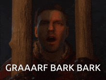 a man behind a wooden fence with the words graaarf bark bark below him