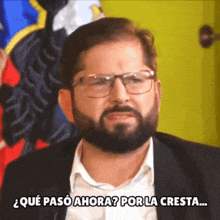 a man with glasses and a beard says " qué paso ahora "