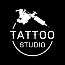 it is a logo for a tattoo studio with a tattoo machine in a circle .