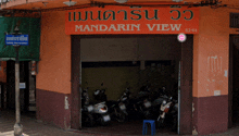 an orange building with a sign that says mandarin view on it