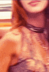 a blurry picture of a woman wearing a choker