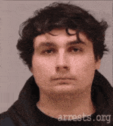 a man 's face is shown in a mugshot from arrests.org