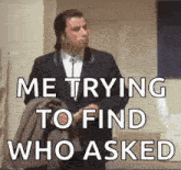 a man in a suit and tie is holding a jacket and says me trying to find who asked .