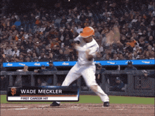 a baseball player named wade mcckler is about to hit a ball