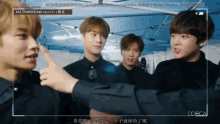 a group of young men are standing in front of a sign that says astrodoca
