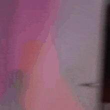 a blurry picture of a person behind a door with the words i 'm just watching you talk