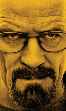 a man with glasses and a beard is looking at the camera