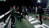 a group of people standing around a boxing ring that says munich