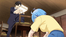a man in a suit is pointing at a girl kneeling down