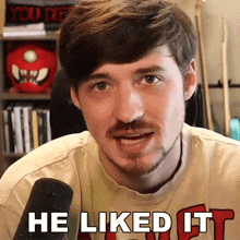 a man with a beard wearing a t-shirt that says he liked it