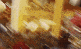 a blurry picture of a building with a yellow pillar