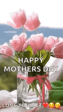 a vase filled with pink flowers with the words `` happy mothers day love you net '' written on it .