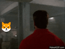 a man in a red shirt with a dog on his head is walking towards another man