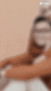 a blurred image of a person with a capcut logo on the bottom