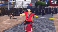a woman in a red ninja costume is standing in front of a crowd of people