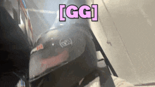 a person wearing a helmet with the word gg written on it