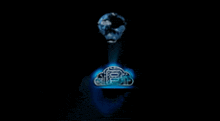 a person is holding a glowing cloud with the letter b on it