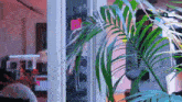 a palm tree with a sticky note on it that says ' i love you ' on it