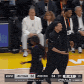 a basketball game between las vegas and phoenix is being played