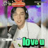 a man wearing headphones with the word love u on the bottom right