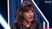 a woman on a television show with the words martinez hermanos on the bottom