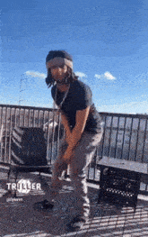 a man dancing on a balcony with the word triller on the bottom right