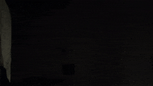 a blurred image of a person 's arm in the dark .