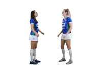 two female athletes wearing blue and green jerseys with the letters lg on them are giving each other high fives