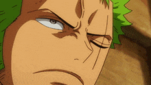 a close up of a man 's face with a serious look on his face
