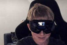 a person wearing a virtual reality headset with the word msv on the back of their shirt