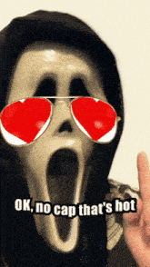 a scream mask with red heart shaped sunglasses and the words ok no cap that 's hot