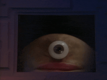 a close up of a person 's face with one eye
