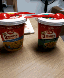 two cups of mr 3 minute breakfast with red spoons in them