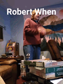 a man is standing in front of a stack of pizza boxes with the words " robert when " above him