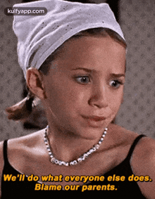 a little girl wearing a headband and a necklace says we 'll do what everyone else does blame our parents