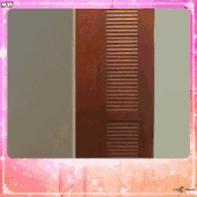 a picture of a door with a pink frame and the word mw on the bottom