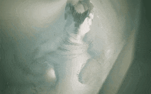 a computer generated image of a tunnel with a statue of a person in the middle .
