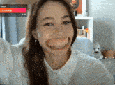 a woman is making a funny face in front of a screen that says pixverse ai
