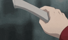 a person is holding a piece of paper in their right hand