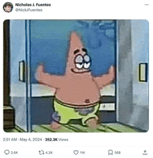 patrick star from spongebob squarepants is standing in front of a glass door and smiling .