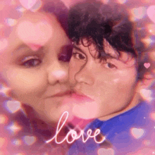 a man and a woman are kissing in front of a pink background with the word love written on it