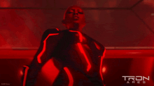 a tron ares poster with a glowing object on it