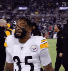 a football player with a beard wearing a number 25 jersey