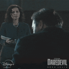 a poster for daredevil born again shows a man and woman