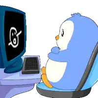 a penguin is sitting in front of a computer monitor with a smiley face on it
