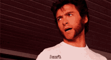 a man with a beard is wearing a white shirt and says " i can 't "