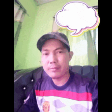 a man sitting on a couch with a speech bubble in the background