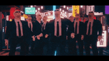a group of men in suits and ties are standing in front of a sign that says 404