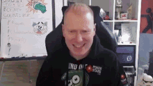 a man wearing a black hoodie that says uno die poker stars